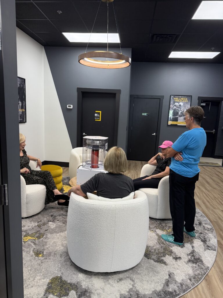 People conversing in a modern office lounge.