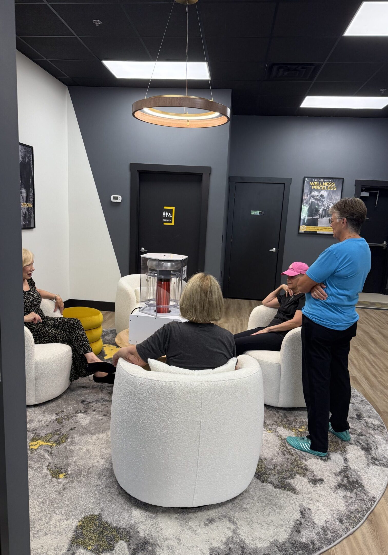 People conversing in a modern office lounge.